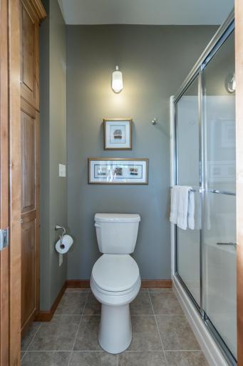 Well-maintained ensuite with ample storage.