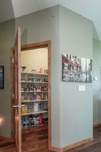 Spacious walk-in pantry provides exceptional storage.