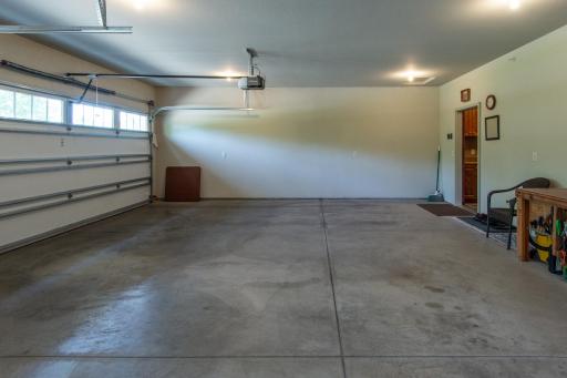 Spacious garage with room for your vehicle, golf clubs, and outdoor gear.