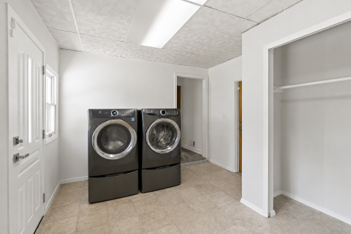 Main level laundry room with newer washer and dryer. Plenty of storage just off the kitchen.
