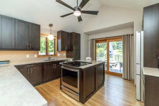 Spacious Kitchen With Patio Door to Multi-Tier Deck