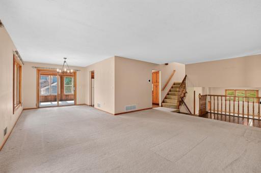Living room and dining room expand into the 3 season porch for extra living and entertaining space