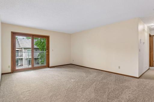 Living room with sliding glass doors to deck