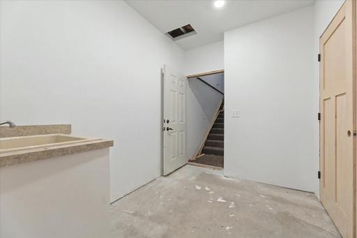 Secondary Entrance from Garage to Lower Level. Home could be easily divided for multi-generational living.
