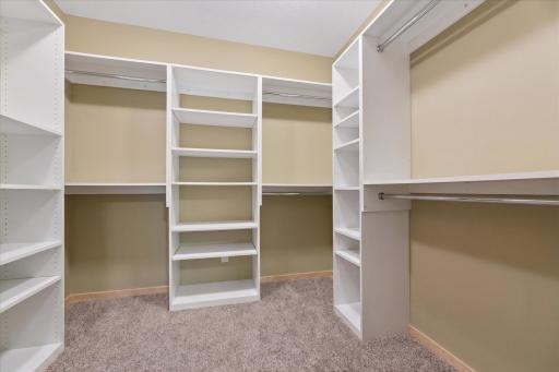 Walk-in closet with custom organization hang and shelving. Alternately use this for seasonal clothing and linens.