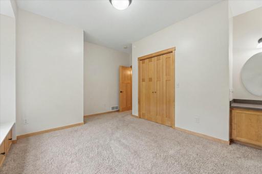Bedroom #2 - Featuring large closet with custom organization, window bench and built-in desk/makeup vanity.