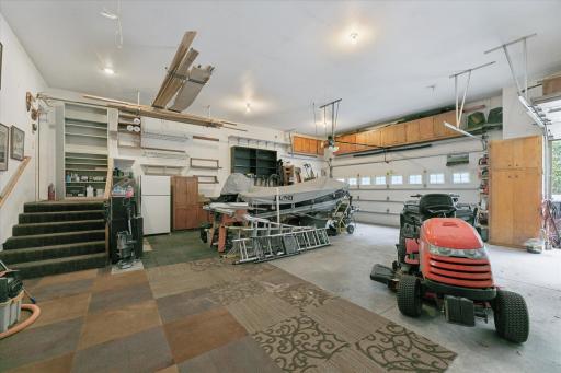 This garage measures approx 36'x38' with 8' garage doors so park that jacked-up-truck with a hitch, boats, mowers, toys, etc.