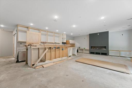Semi-Finished: Gas fireplace with built-in cabinets for storage and seating. Electrical roughed in for kitchen, fireplace and ceiling surround sound.