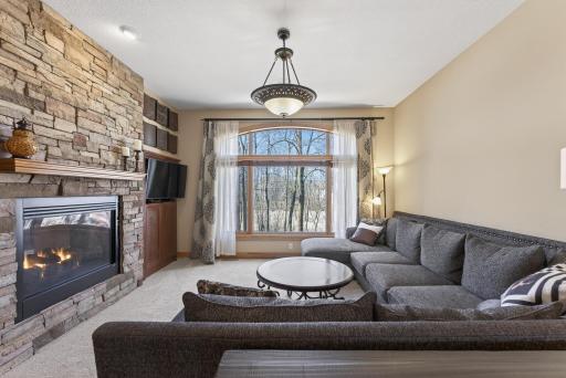 Cozy meets elevated â anchored by a stunning stone fireplace