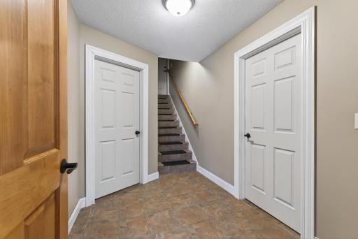 Back staircase going up to the garage from the lower level