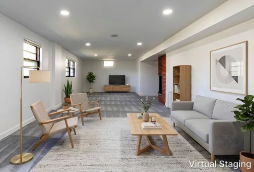 Virtual staging in the lower level helps to visualize how you could utilize this space.
