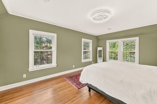 Primary bedroom with serene treetop views