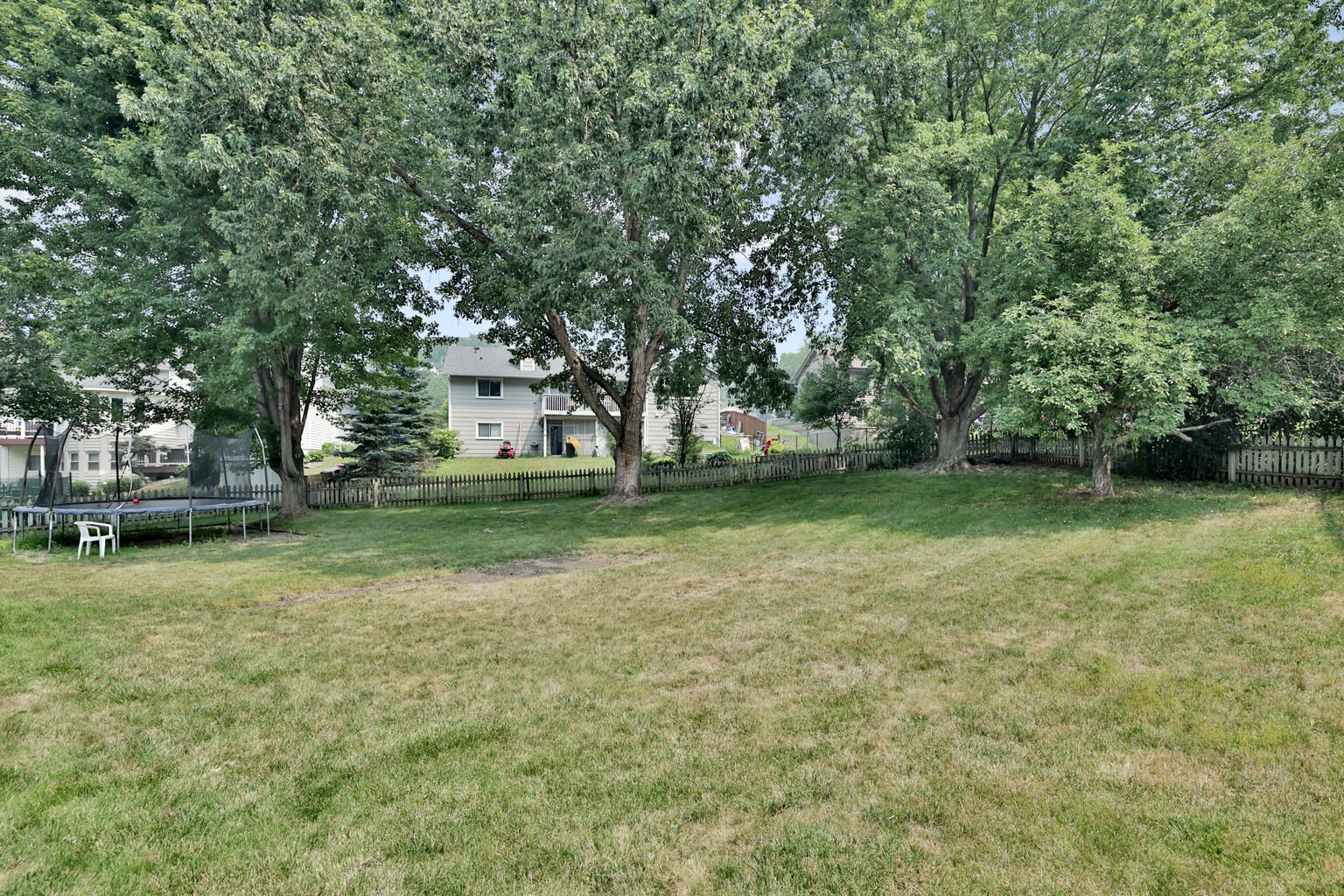 spacious yard with mature trees