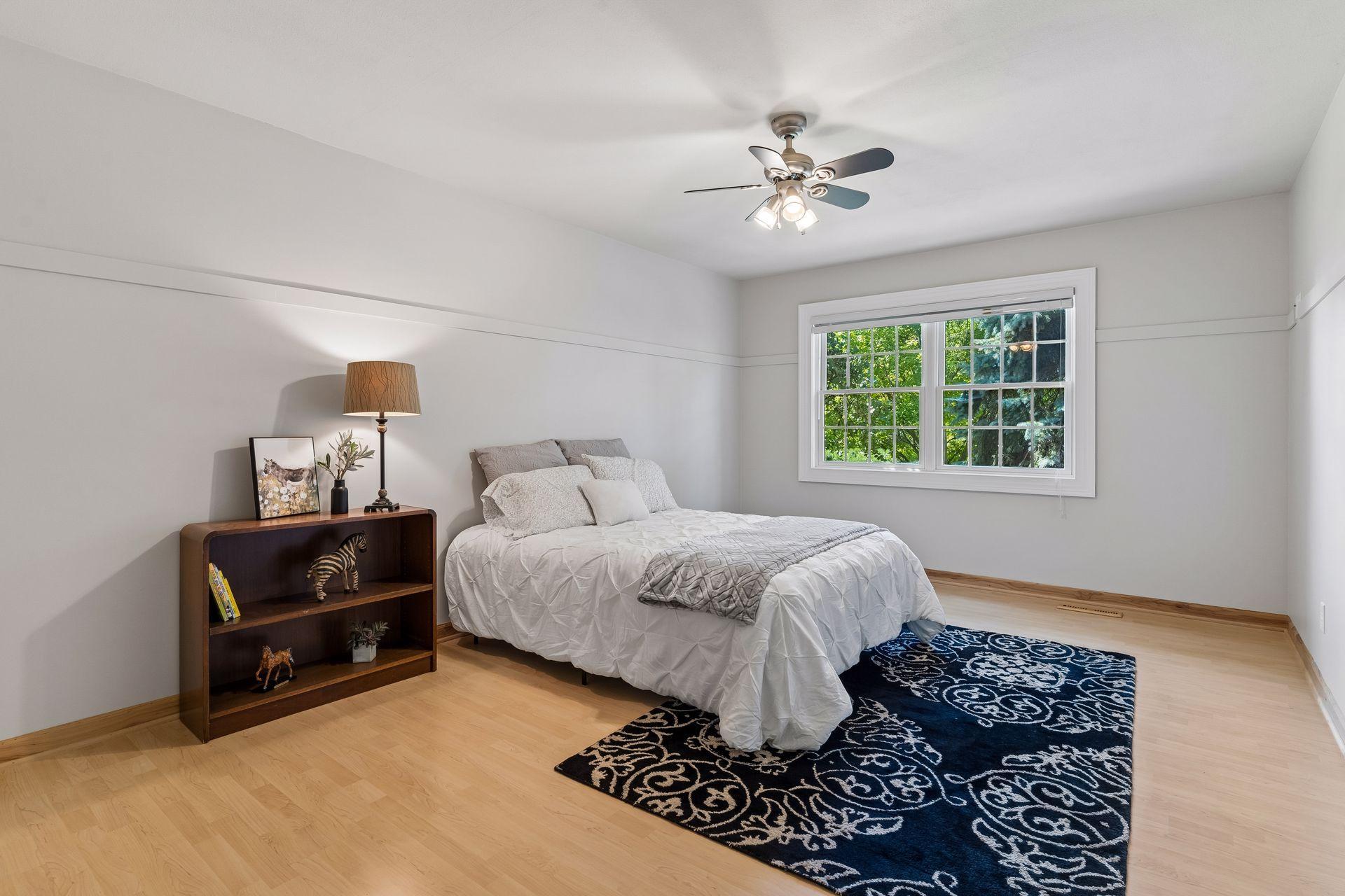 This spacious fourth Bedroom features a large window overlooking the backyard. Great space for guests or family.