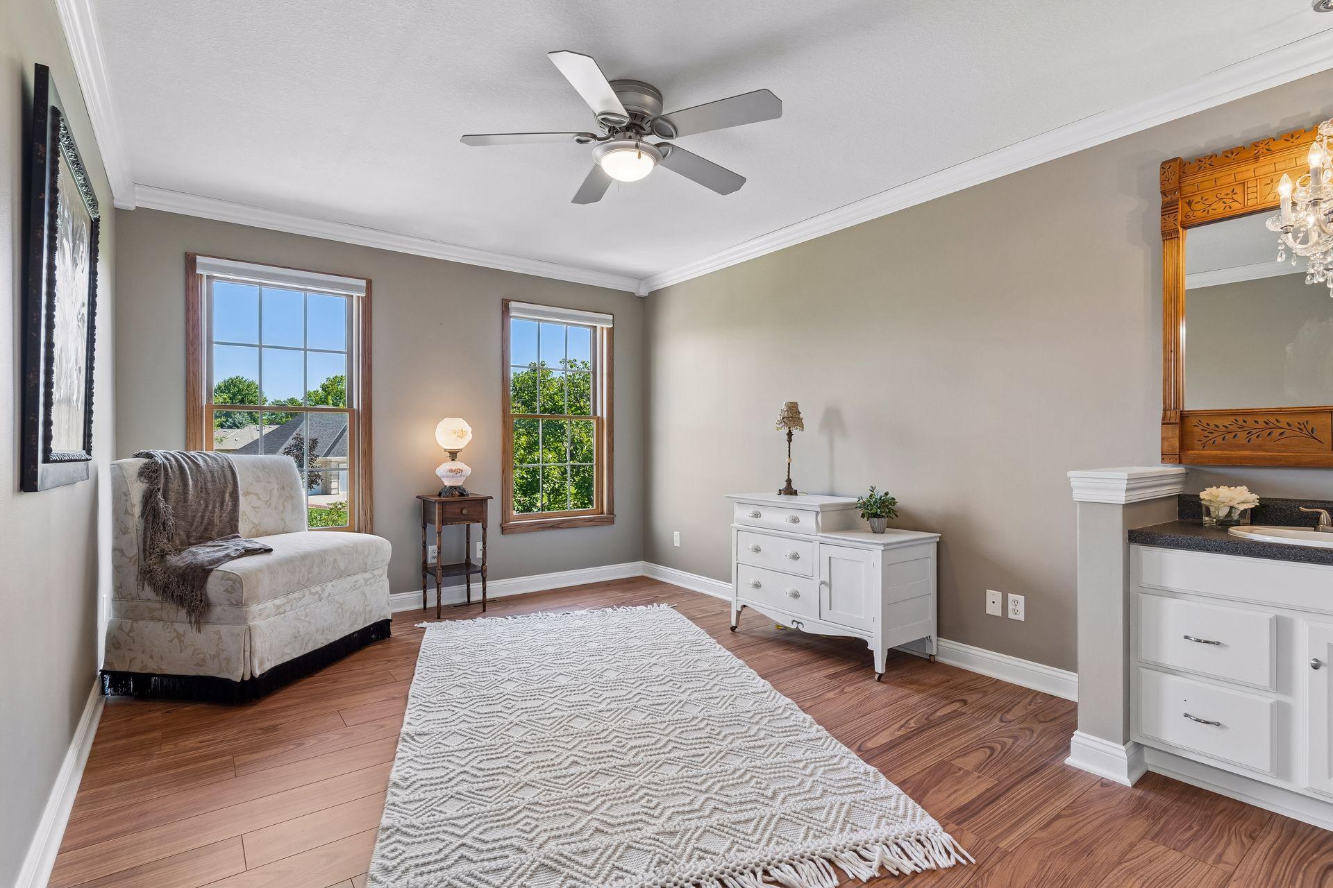 The 2nd upper Bedroom has Crown Molding, two large windows and a walk-in closet.