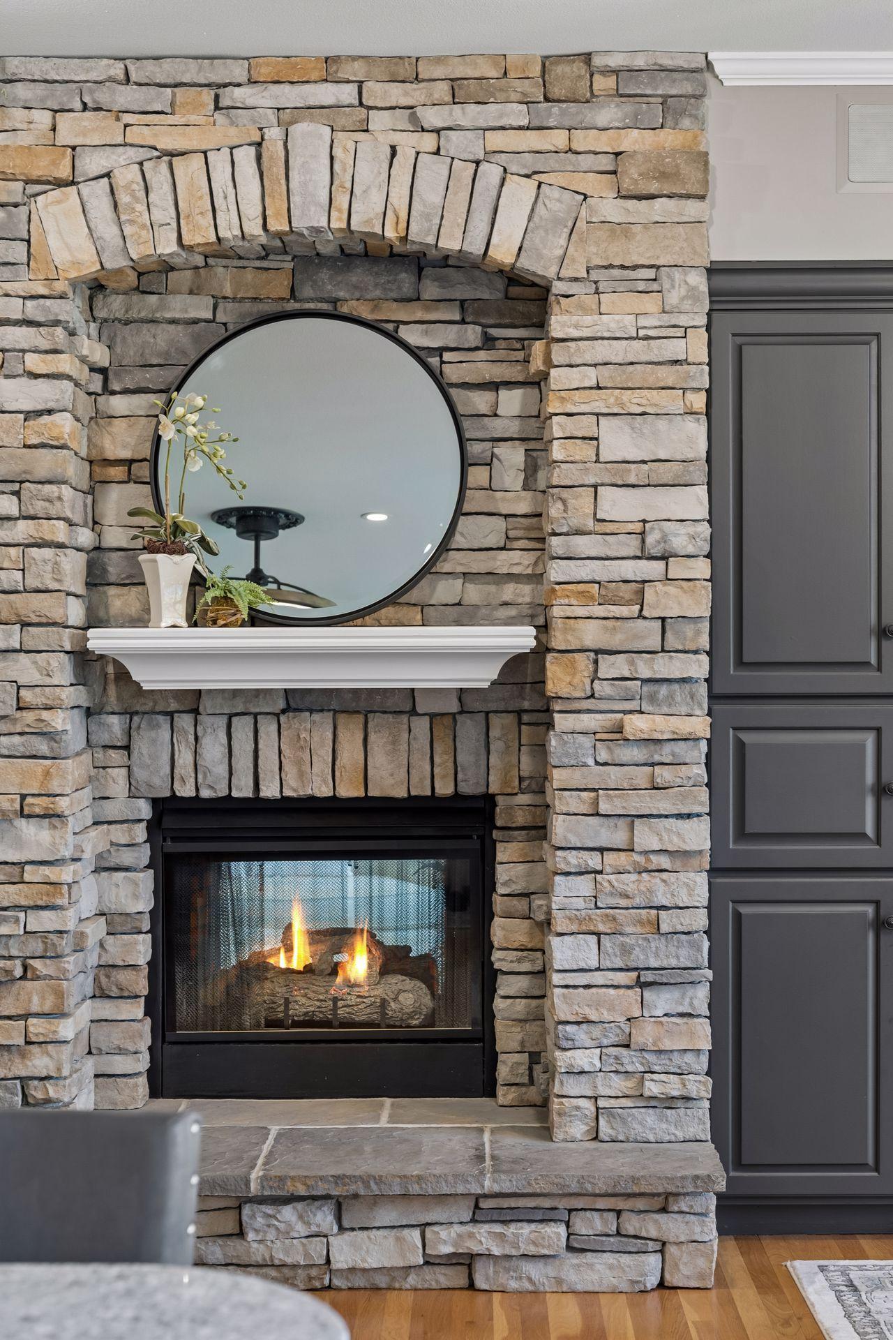 The stunning double-sided Gas Fireplace creates a warm focal point, allowing both the Hearth Room and Great Room to enjoy its beauty and ambiance.
