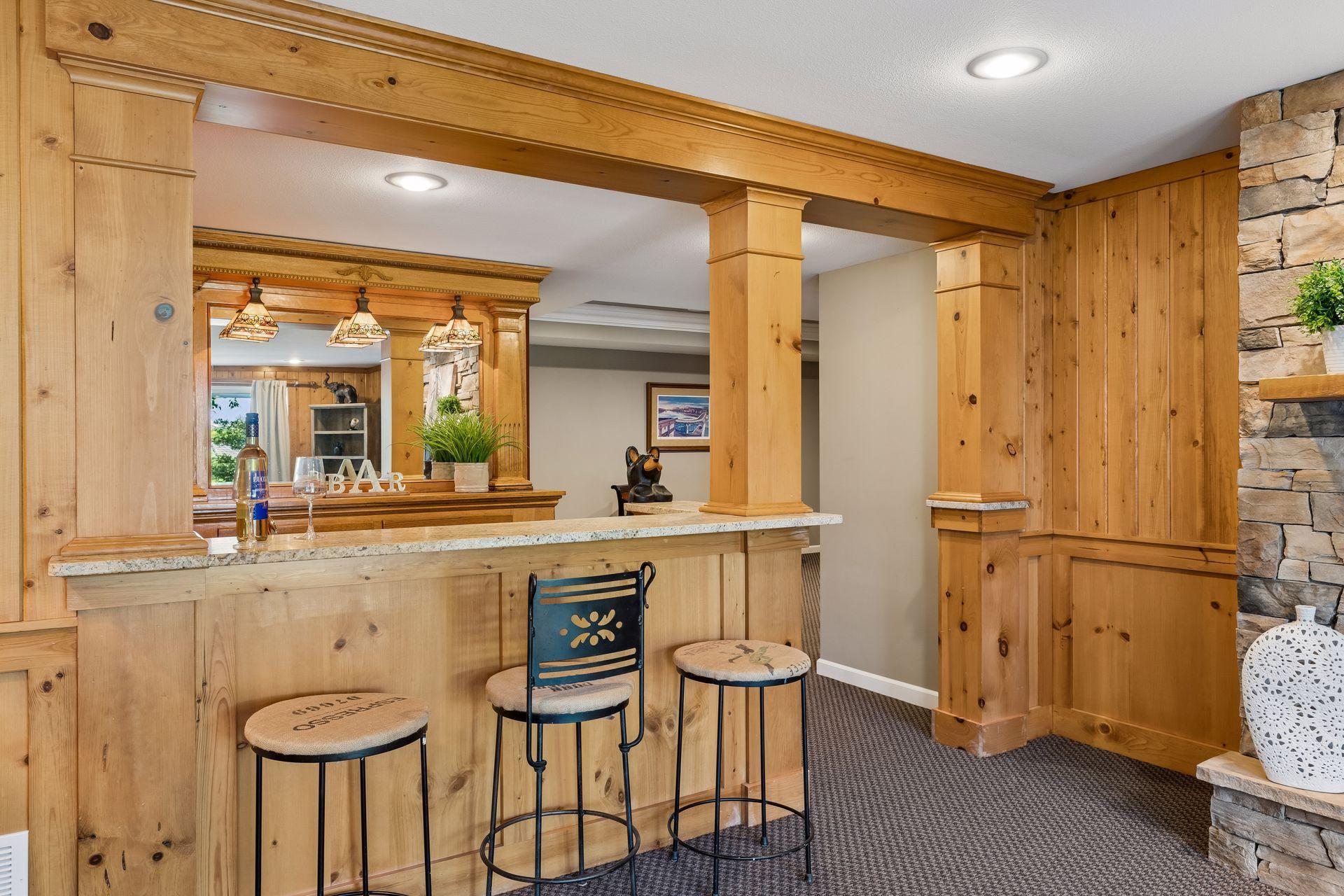 The lower-level wet bar has Granite countertops and a one-of-a-kind antique bar - a memorable space for entertaining.