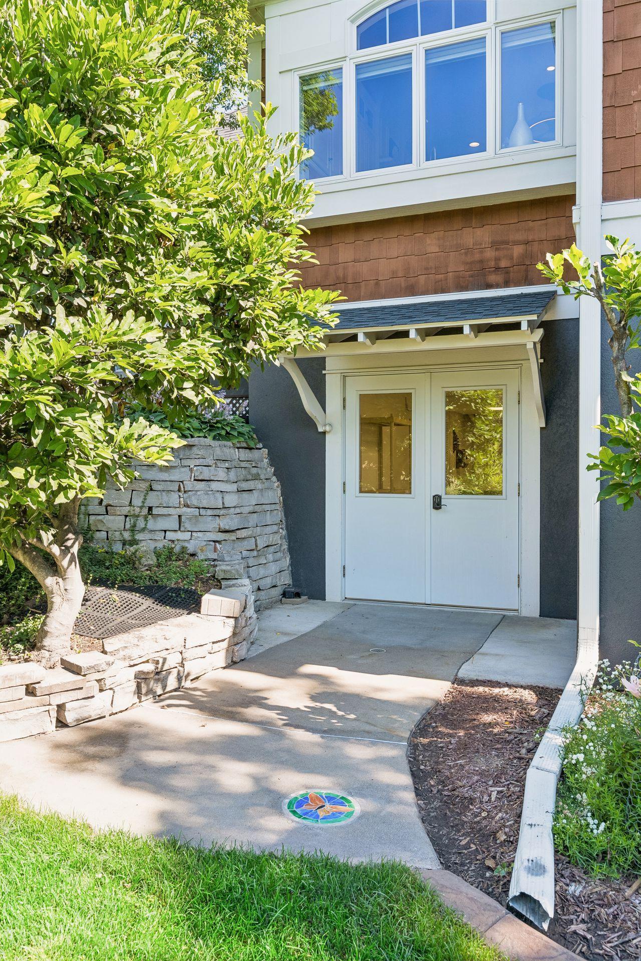 Located beneath the home, the built-in Garden Garage offers exterior double-door access, allowing you to drive a riding mower directly inside.