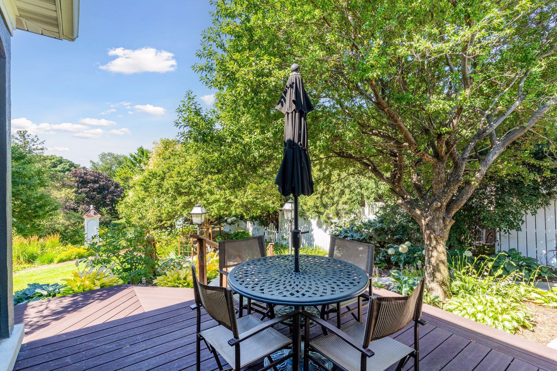 Enjoy peaceful views from the Deck overlooking the private backyard beyond.