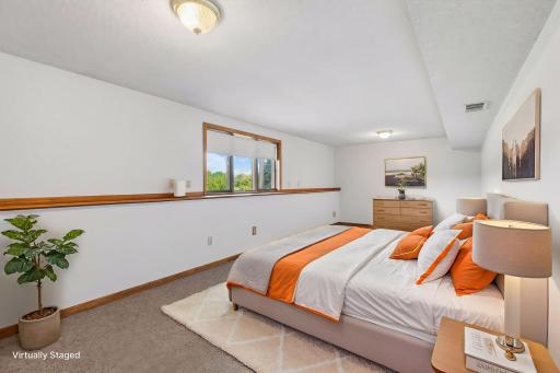 Virtually Staged Lower Level flex space suitable for 3 living space, guest quarters, play area, etc (presently no closet)