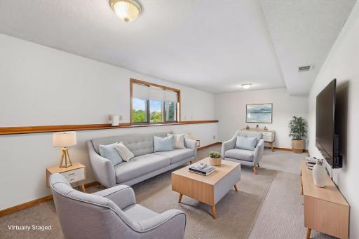 Virtually Staged Lower Level flex space suitable for 3 living space, guest quarters, play area, etc (presently no closet)