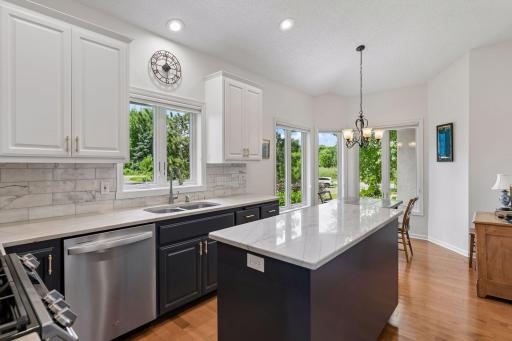 Remodeled kitchen in 2024 with granite, SS appliances, enameled cabinets with pull-out drawer storage.