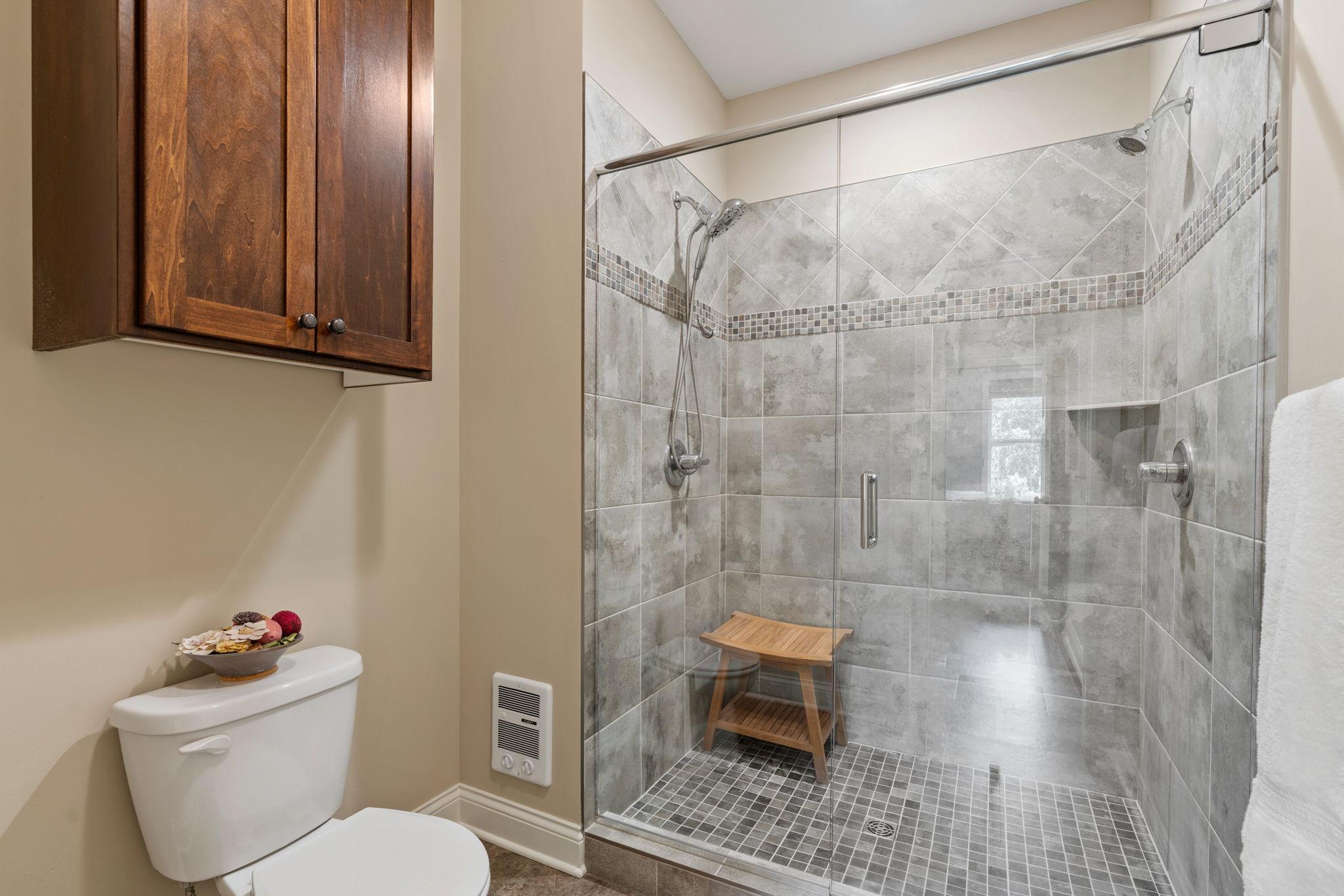 Spacious Primary Suite on ML w/ dual vanities, oversized tiled shower, walk-in closet & walk-through to Laundry