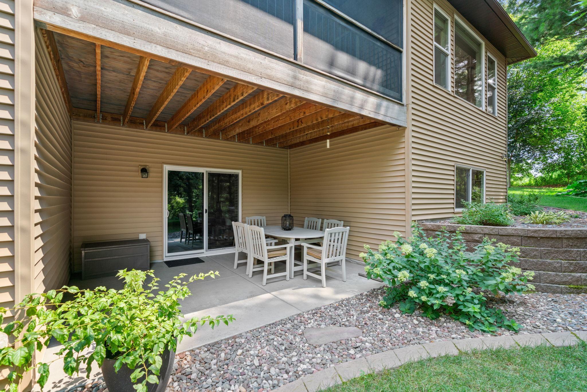 Walk out Lower Level to covered, concrete porch.