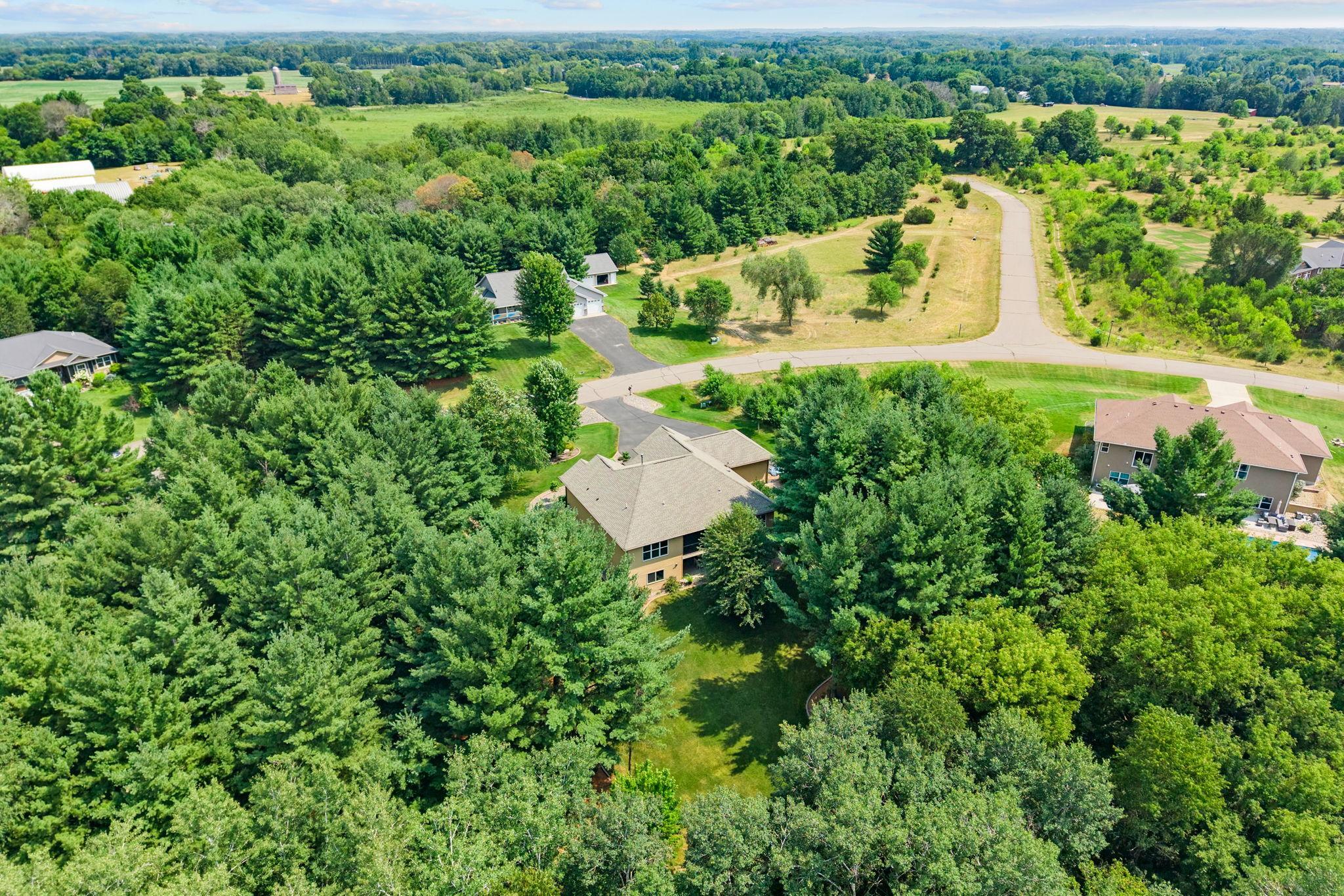 Private 2.5-acre lot w/ mature trees, stunning landscaping & exceptional privacy