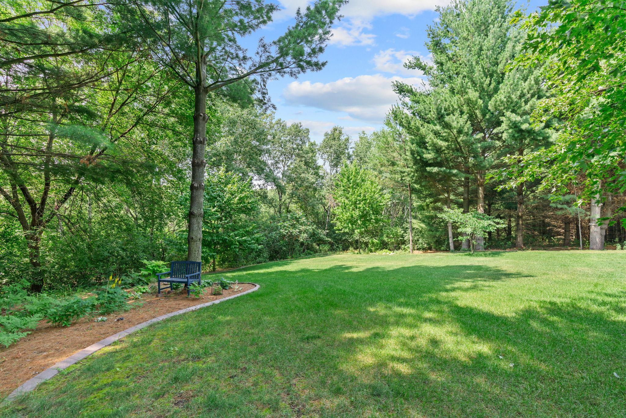 Private 2.5-acre lot w/ mature trees, stunning landscaping & exceptional privacy
