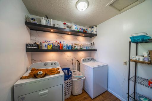 Laundry on Main with added Floating shelving with Lighted Accents and Tile Wall (Washer & Dryer Included)
