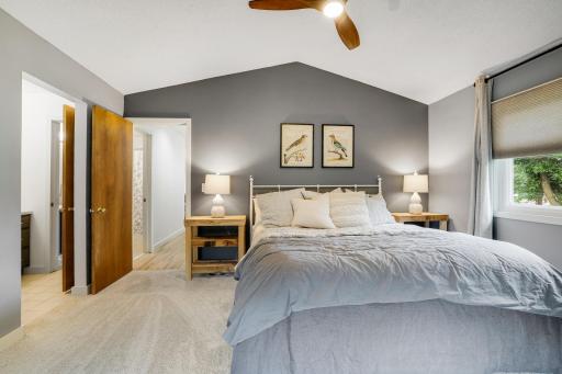 Primary bedroom easily accommodates this king size bed and nightstands