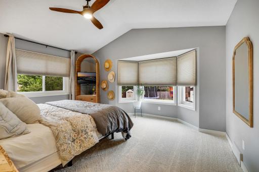 Spacious primary bedroom with high ceilings