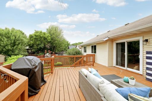 Deck includes steps to get down to the fully fenced backyard
