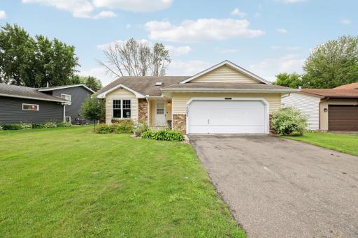The 2-car garage is actually quite spacious with high ceilings and a little extra room on the sides for toolboxes or shelving