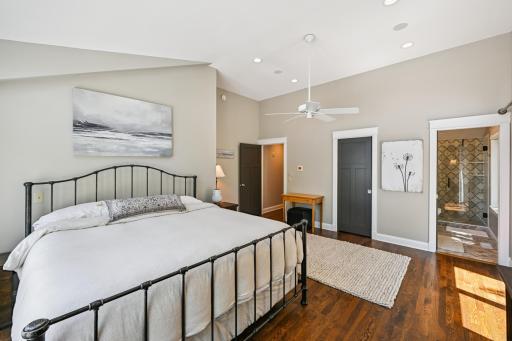 This spacious bedroom suite is nearly 400 sq ft with rich hardwood floors and updated windows and doors, offering comfort, style, and plenty of natural light in this luxury lakeside retreat.
