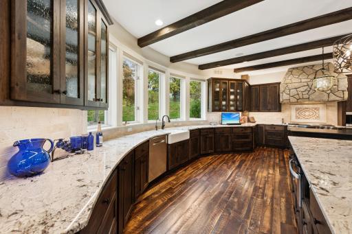Enjoy crystal-clear water from the farmhouse sink with a dedicated reverse osmosis system, paired with a whole-home Kinetico water filtration system, all in a beautifully updated kitchen with serene views.