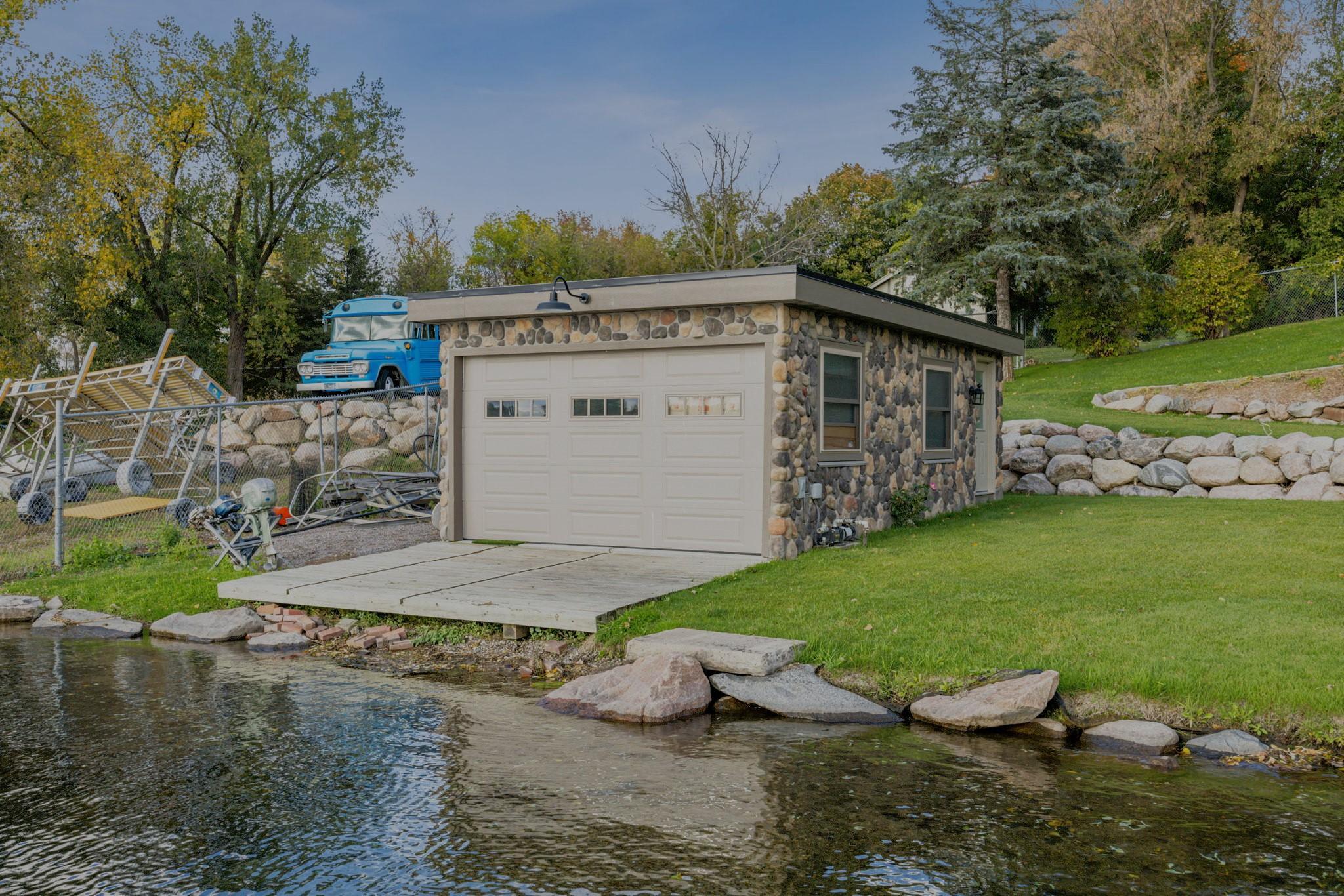 This 25x15 boathouse sits right at the water’s edge, an increasingly rare find. Offering endless possibilities for lakeside entertaining, storage, or hobby space.