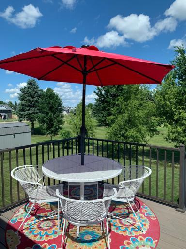 Deck looks out over the fenced backyard and backs up to the 7th hole