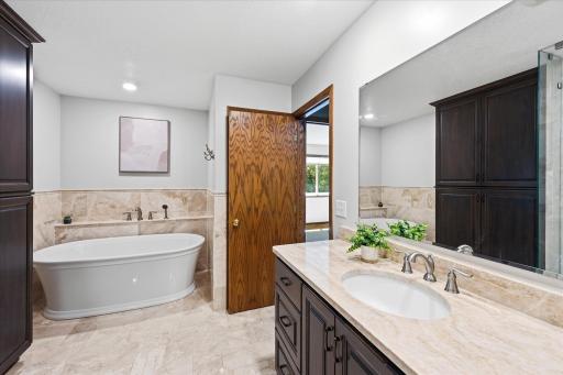 Enjoy both a soaking tub and tiled walk-in shower.