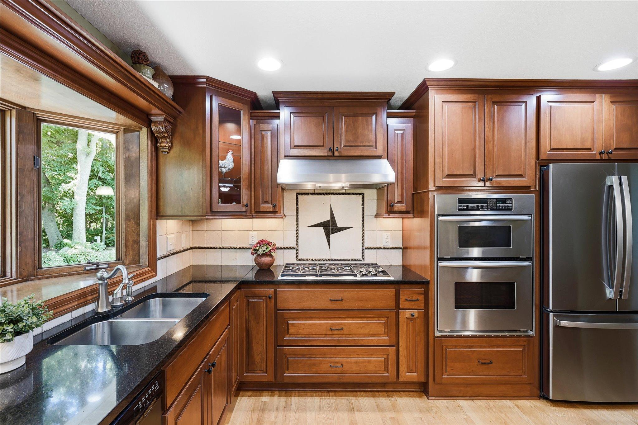 Stainless steel appliances complete the space.