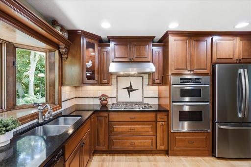 Stainless steel appliances complete the space.