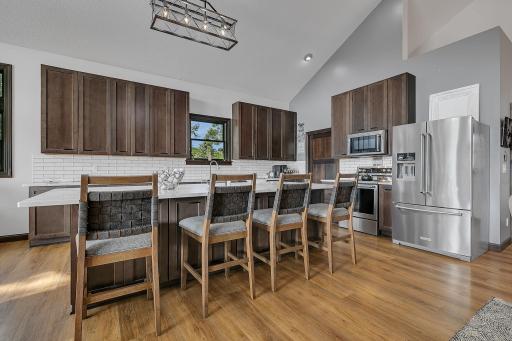 Kitchen unveils large center island, amazing cabinetry and stainless appliances.