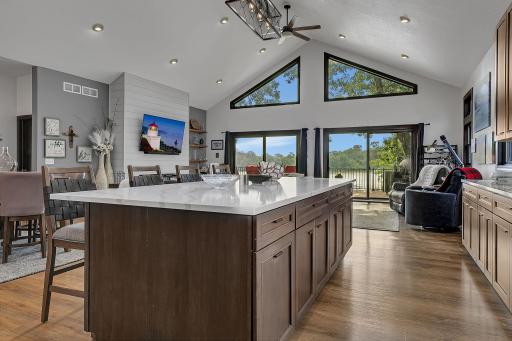 Great merging of stained cabinetry, shiplap accents in the main grand room wall.