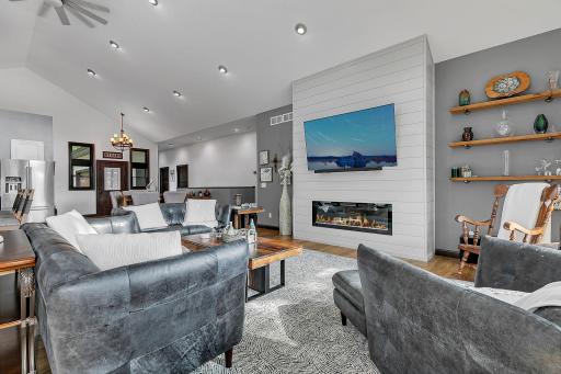 Living room is open and flexible with laminate flooring bringing all the spaces together.
