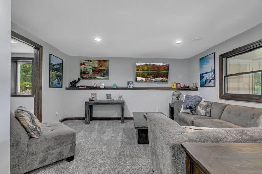 Lower living room with flex space to the right.