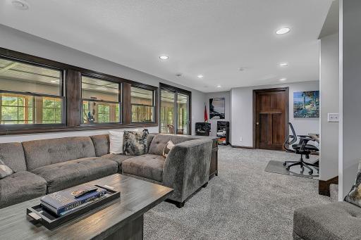 Lower level living with views to the tuck under 3 season porch.