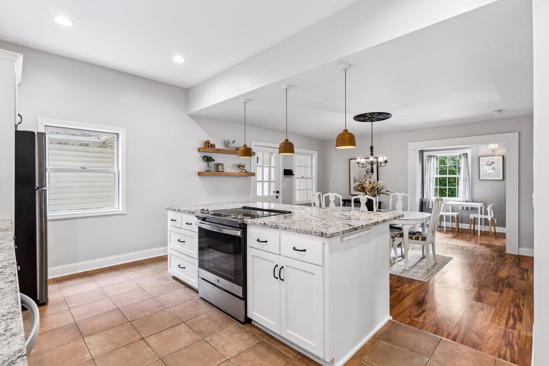 Kitchen with view of the dining room and breezeway entrance