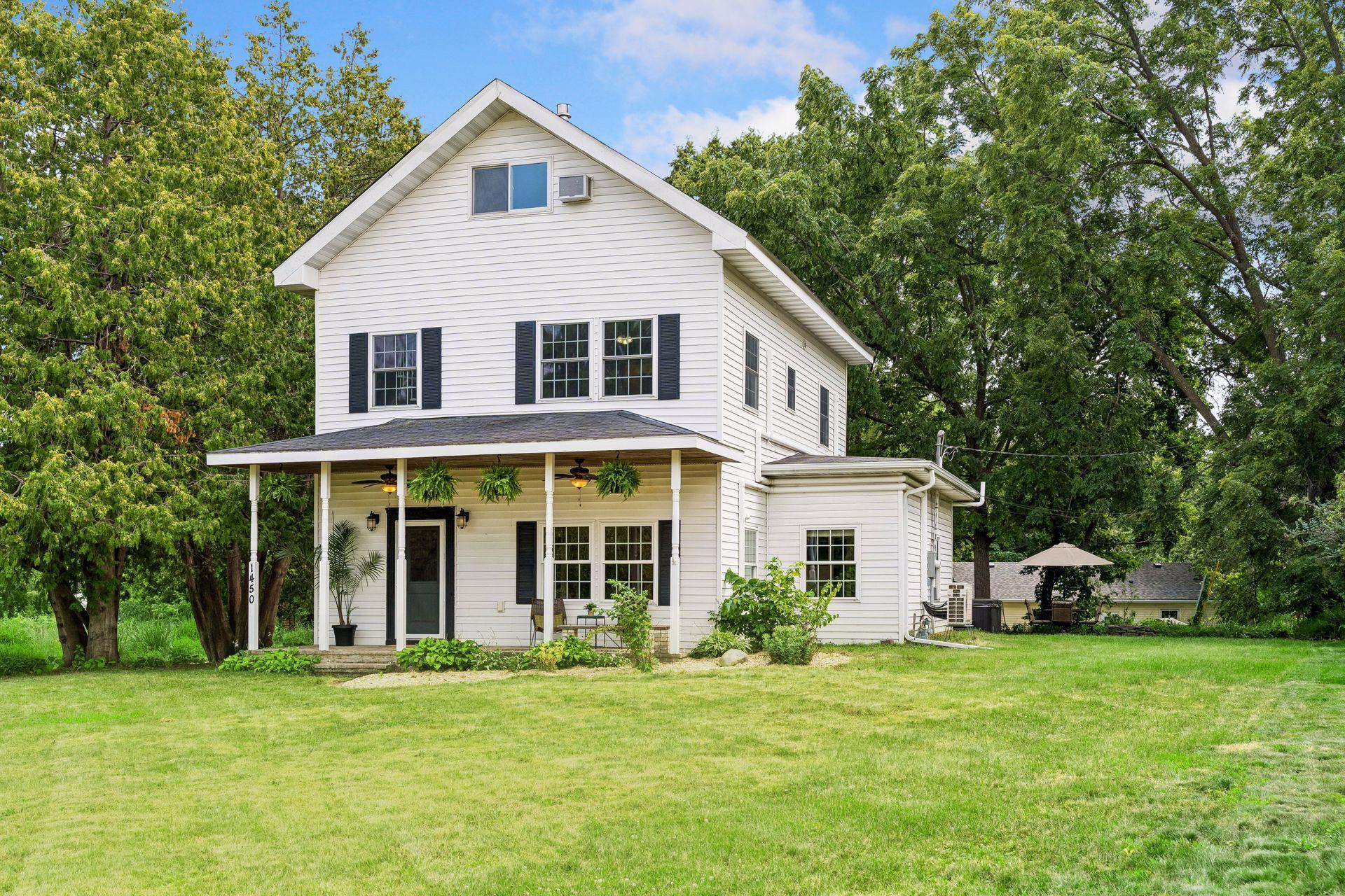 Stunning front porch with spacious yard