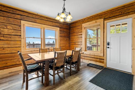 Dinning room with original logs add to the charm
